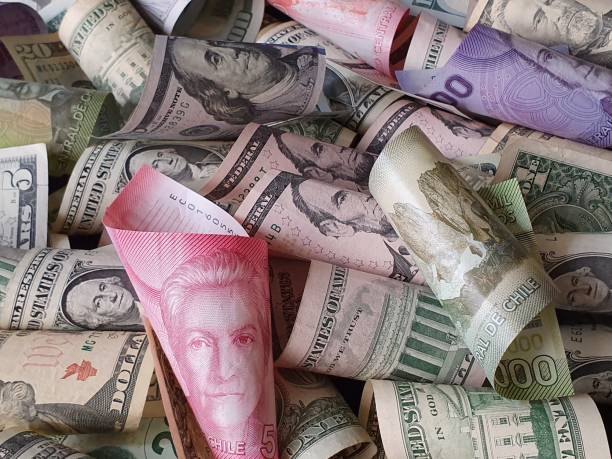 istock Chilean banknotes and American dollar bills unorganized 1185328666