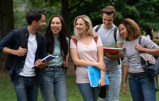 istock Happy multi-ethnic group of students at the park 1185328699