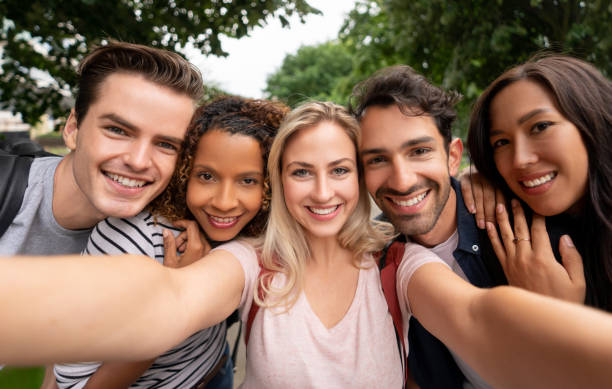 istock Happy group of students taking a selfie 1185328723