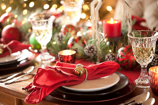 Christmas holiday dining table elegant place setting. Very shallow depth