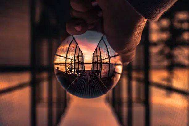 lensball reflecting sunset, photographed up close in the pnw