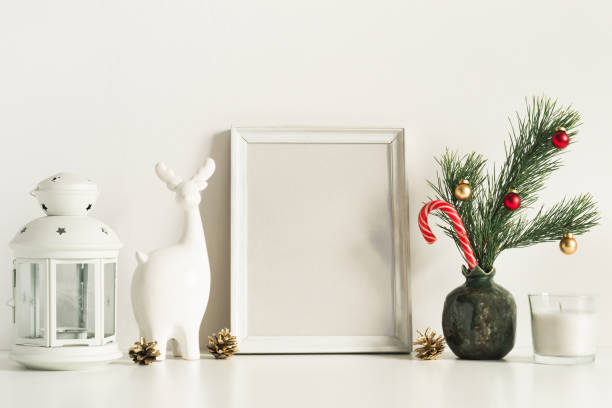istock White Composition with little Christmas tree in vase, deer and candles. Front view mockup template 1185342325