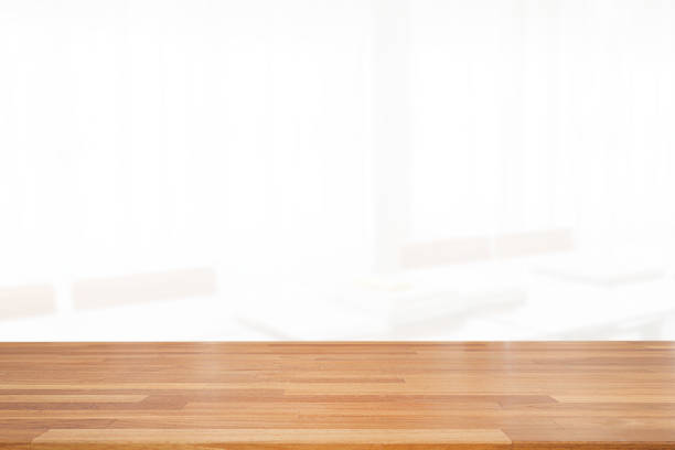 istock Beautiful empty wood table top on white clear indoor room background with curtain. copy space. Ready for product montage advertise 1185345002