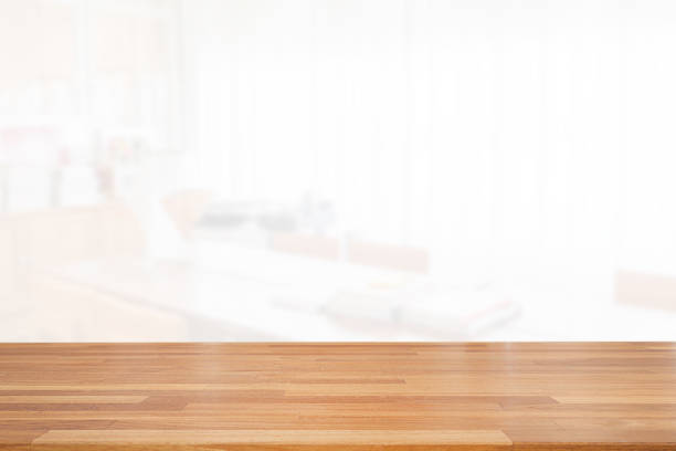 istock Beautiful empty wood table top on white clear indoor room background with curtain. copy space. Ready for product montage advertise 1185345026