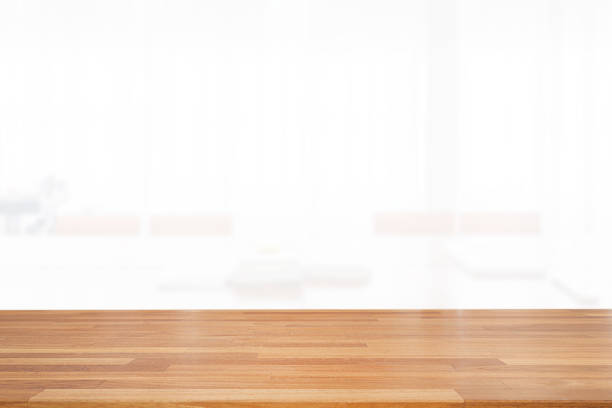 istock Beautiful empty wood table top on white clear indoor room background with curtain. copy space. Ready for product montage advertise 1185345087