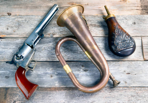 antique pistol ,bugle and powder flask. - bugle trumpet brass old fashioned imagens e fotografias de stock