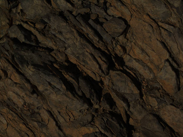 istock Dark brown rock background. Stone texture. Abstract grunge stone background. 1185350434
