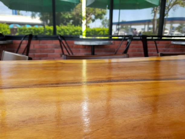 istock wood table in coffee shop , can used display products 1185353443