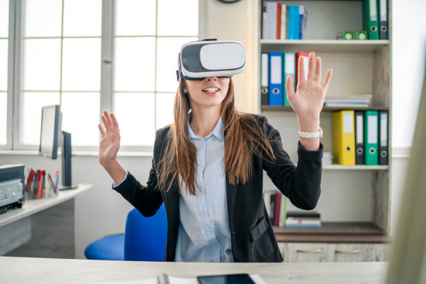 istock Woman trying a VR device 1185354448
