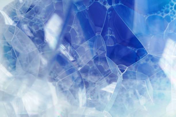 istock soap foam macro background.blue texture of soap foam close-up. Bath foam. Ease.Lightness and airiness.Foamy Cleaner Background.Cleanliness and order concept 1185354512