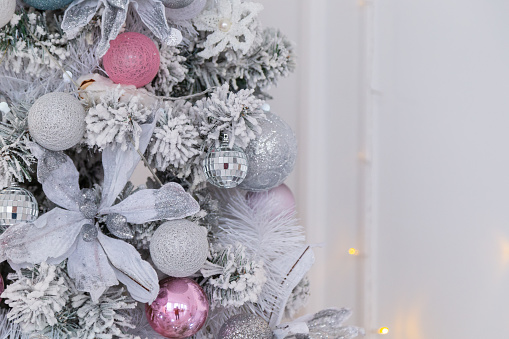 Beautiful silver Christmas tree with decorations. New Year 2020