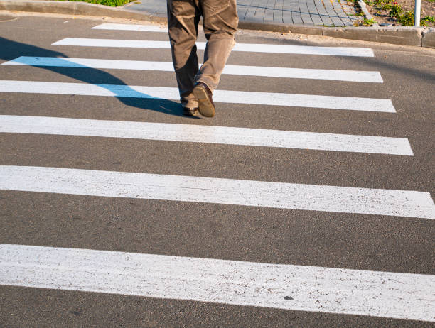 istock Pedestrian crossing the zebra road. 1185358004