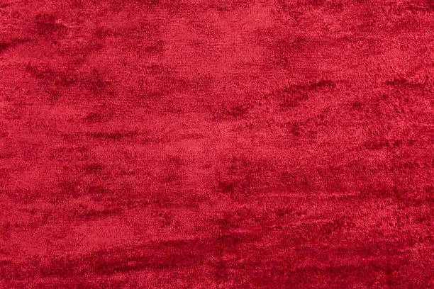 Red velour. Background from textured fabric