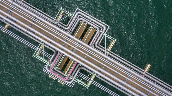 Aerial top view gas and oil pipe line in the ocean.