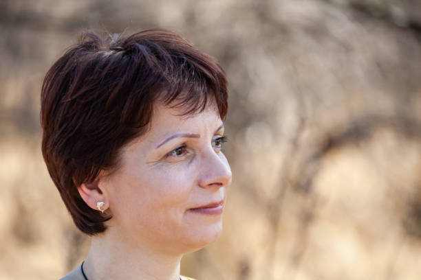istock Brunette, Caucasian smiling woman 1185362337