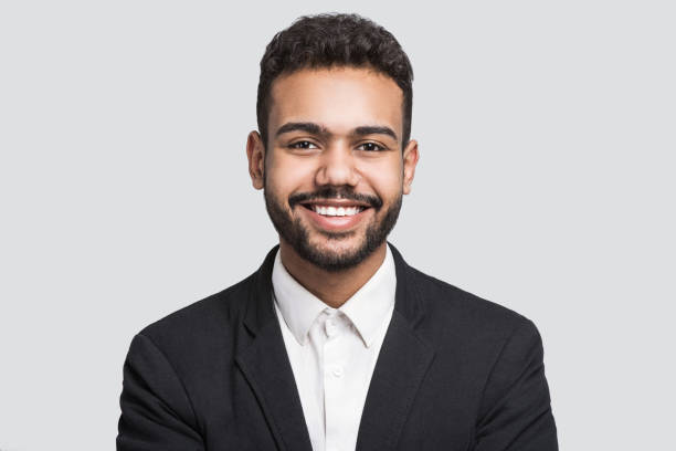 istock Portrait of handsome smiling young man studio shot 1185368774