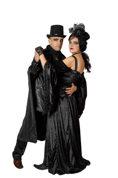 istock Cute couple dressed in old fashioned vampire style clothes 1185369022