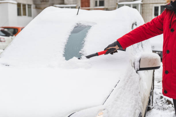 istock after blizzard car covered with snow cleaning concept 1185370454