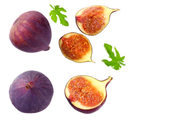 istock Fig fruit with green leaf and slices isolated on white background Top view 1185370754