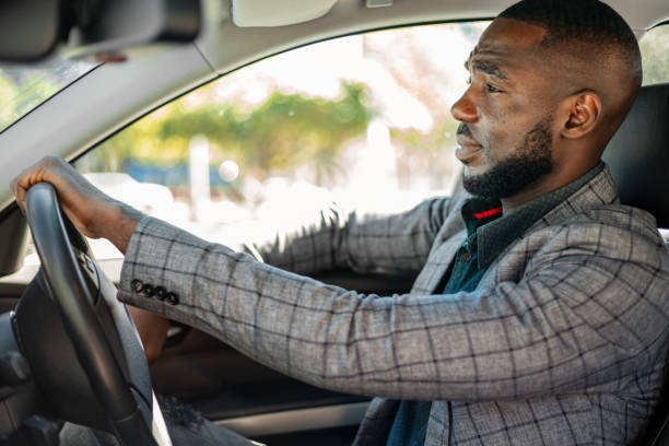 istock Young Businessman Driving Car 1185372129
