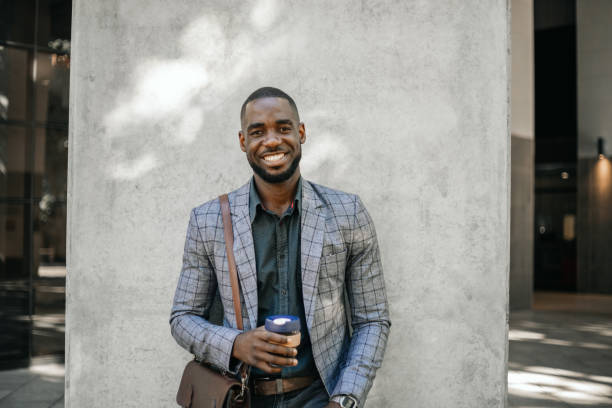 istock Cheerful Businessman With Cup Of Hot Beverage 1185372201