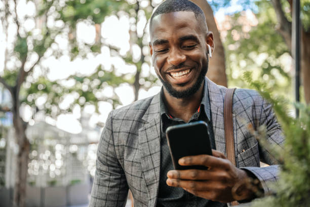 istock Young Man Sits In Cafe And Using Smart Phone 1185373163
