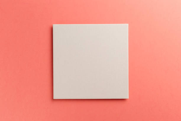 istock Creative layout made of paper blank on pastel on coral background. Top view. Flat lay. Copy space. Colorful background. Minimal creative concept. Living coral - trendy color of the year 2019 1185377801