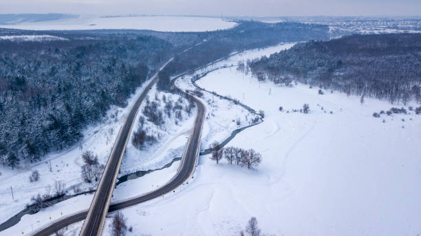 istock Aerial or top view from a drone on a highway in winter weather 1185380165