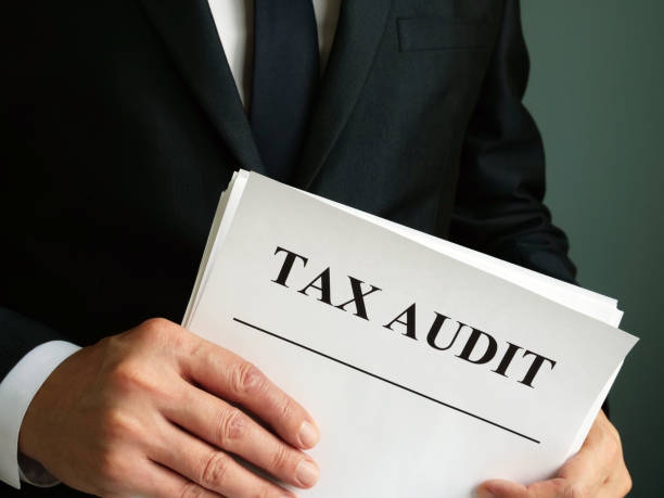 istock Auditor is holding Tax audit report. 1185380213