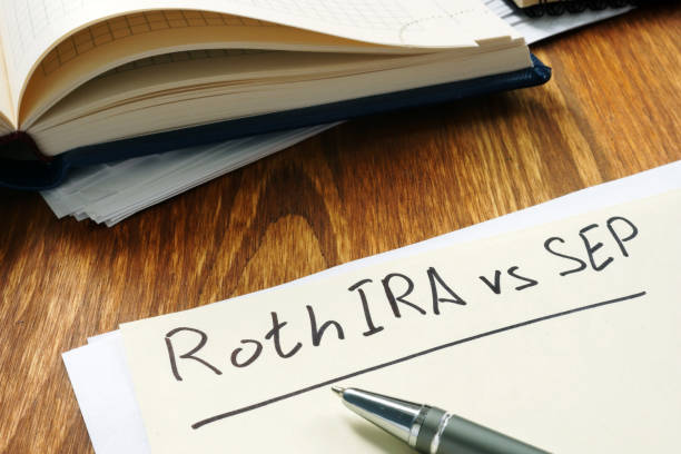istock Roth IRA vs SEP handwritten on the yellow sheet. 1185380246