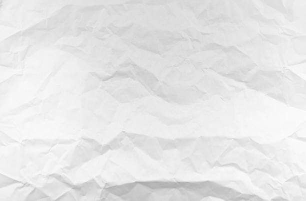 istock Crumpled white Paper as Texture or Background 1185381189