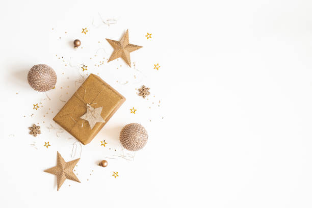 istock Christmas composition. Gift box, golden decorations on white background. Christmas, winter, new year concept. Flat lay, top view, copy space 1185381630
