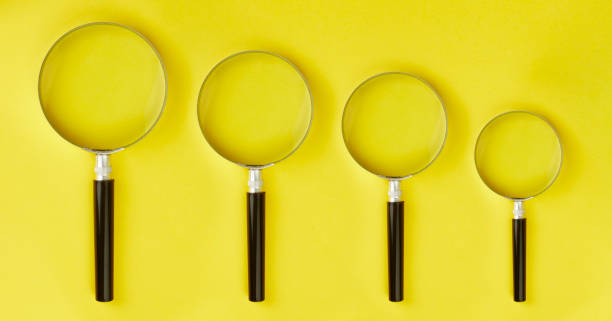 istock 4 magnifying glass stands on yellow background 1185382938