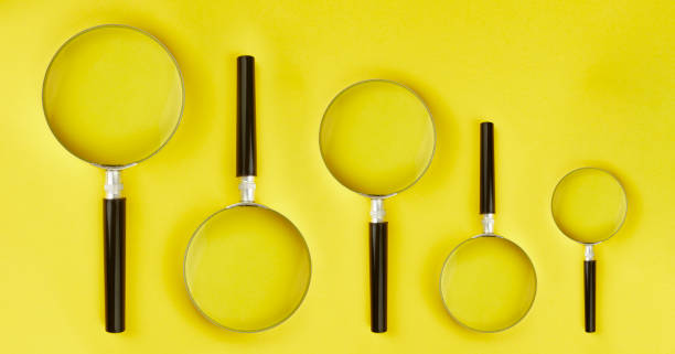 istock 5 magnifying glass stands on yellow background 1185383001