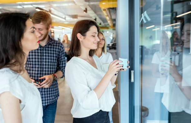 istock Young coworkers in modern office 1185386809