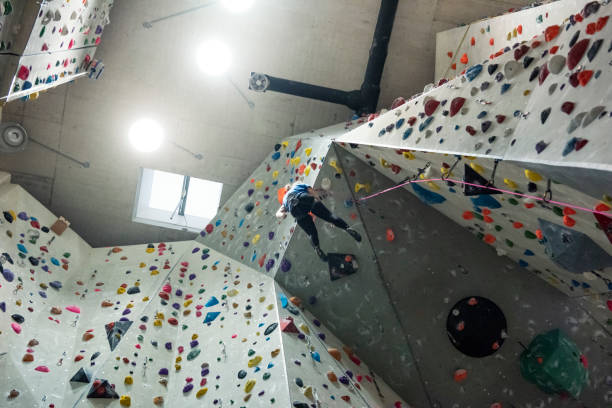 istock Young women climbing on indoor climbing wall 1185388316