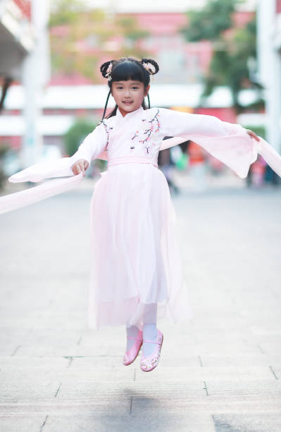 istock A child wears traditional Han costume walking 1185389488