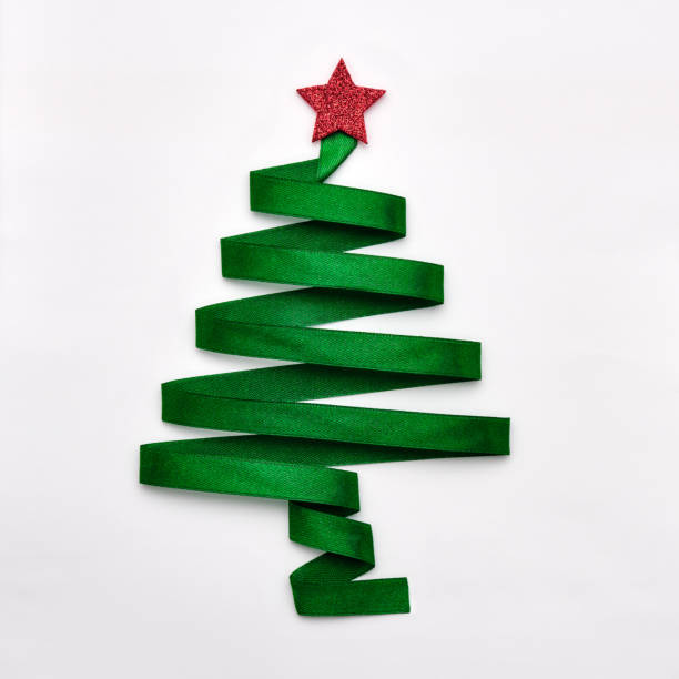 istock Stylized Christmas tree made from green ribbon with red shiny star on white background 1185390677