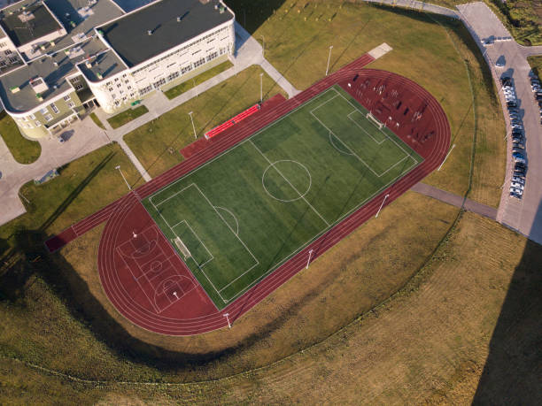 Empty soccer pitch aerial drone top view green field