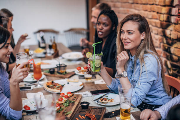 istock Group of friends on lunch outdoors in restaurant 1185391037