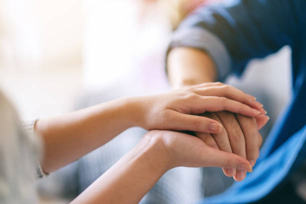 istock A man and a woman holding each other hands 1185391139