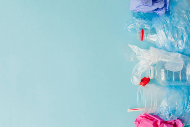 istock Top view of various kinds of disposable plastic waste on blue background, copy space 1185392170