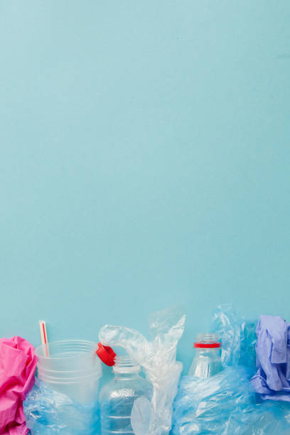 istock Top view of various kinds of disposable plastic waste on blue background, copy space 1185392180