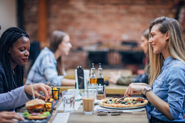 istock Ladies sitting outdoors in restaurant 1185394052