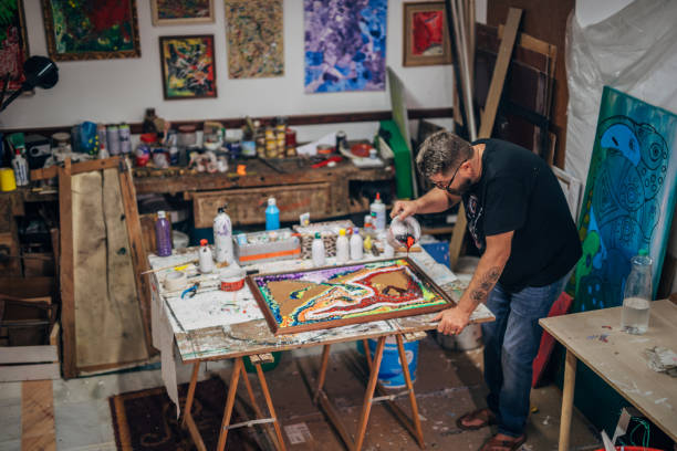 istock Male artist painting 1185397669