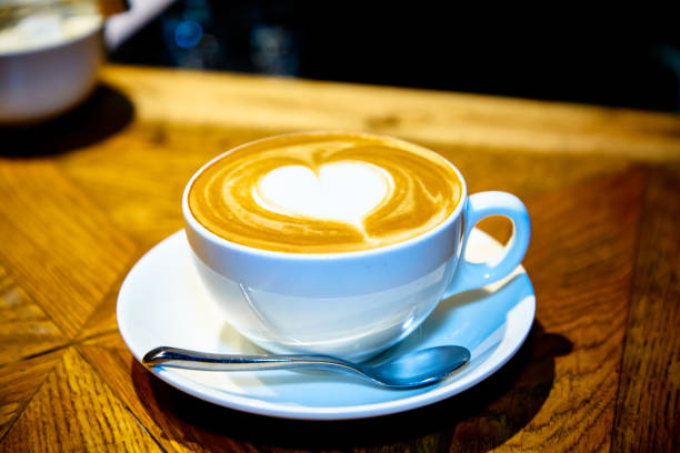 istock Heart on a cappuccino Cup on a wooden table 1185398155