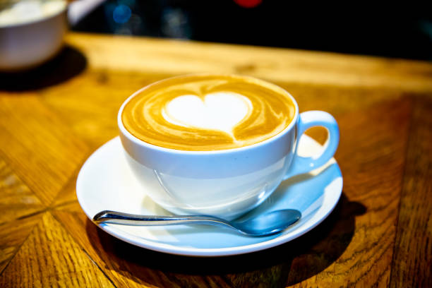 istock Heart on a cappuccino Cup on a wooden table 1185398299