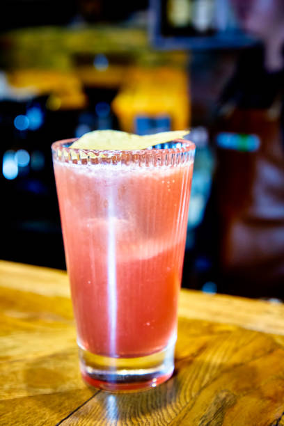 istock Red cocktail with Bay leaf poured into a tall glass 1185398304
