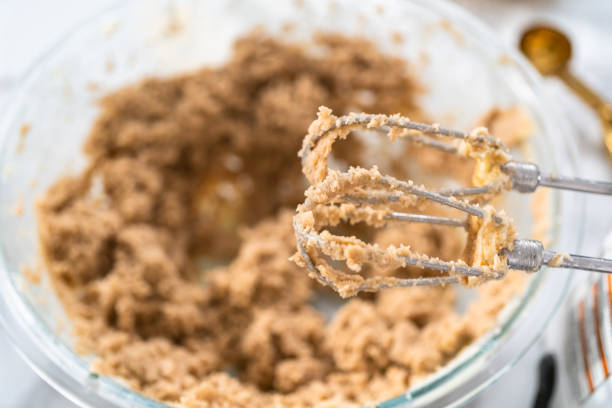 istock Mixing ingredients to bake chocolate chip cookies. 1185398335