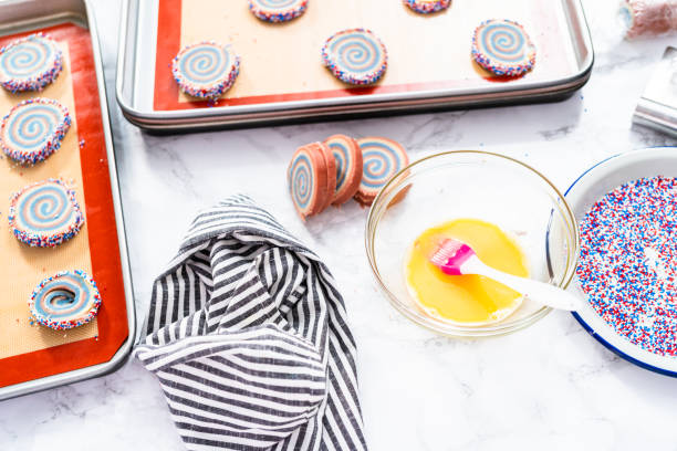 istock Baking red, white, and blue pinwheel sugar cookies 1185399400